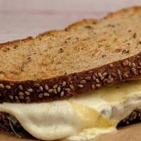 Grilled Cheese · Sliced sesame multigrain bread with melted mascarpone, mozzarella, provolone, and parmesan c...