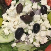 Greek Salad · Mixed greens with tomato, cucumber, onion, Kalamata olives, feta cheese, pepperoncini, and G...