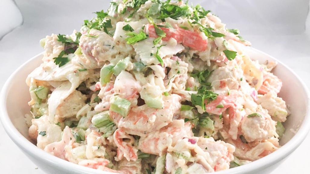 Seafood Salad · This seafood salad is a tasty blend of creamy and crunchy with chunks of imitation crabmeat, chopped celery, white onion, and our classic mayonnaise dressing.
