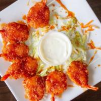 Buffalo Shrimp · Seven pieces. Your choice of hot or mild sauce, and blue cheese.