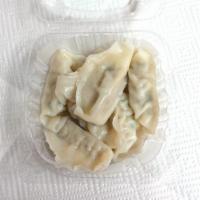 Dumpling · Steam or pan-fried. Pork and chicken dumpling served with ginger sauce. (7 Pcs)