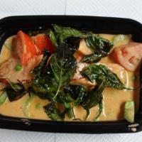 Choo Chee Salmon · Grilled	salmon in Thai hot curry with	green peas, tomatoes, and bell, peppers topped with fr...