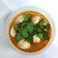 Tom Yum Soup · Chicken or shrimp. Thai hot	and sour broth seasoned	with exotic herbs, mushrooms and cilantro.