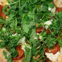 O.A.T Pizza · goat cheese, caramelized onion, arugula, tomato