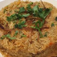 Chicken Biryani · Tender pieces of chicken cooked with basmati rice and flavored with Saffron and special spices