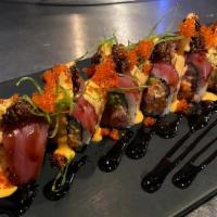 Lady In Red Maki · Spicy tuna, avocado and cucumber, top with tuna, chili wire and tobiko in spicy mayo and una...