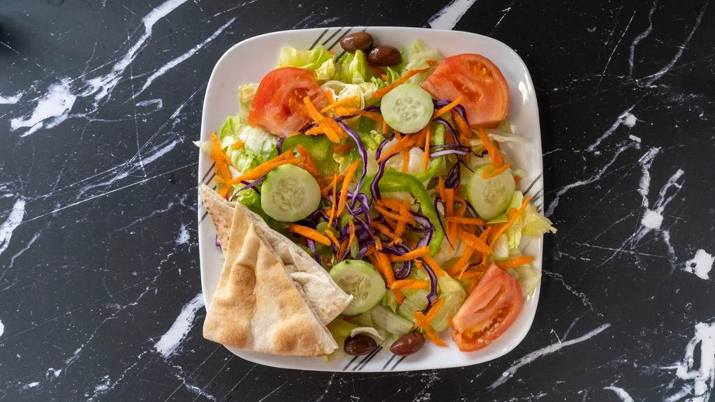 Garden · Pita bread, greek dressing, lettuce, tomato, cucumbers, black olives, carrots, red cabbage and green peppers.