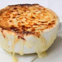 French Onion Soup Au Gratin · caramelized sweet onion, beef jus, country bread, gruyère