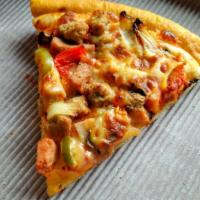 Cheesesteak, Green Peppers, & Onion Pizza Slice · Juicy cheesesteak, green peppers, and onions baked on a fresh pizza.