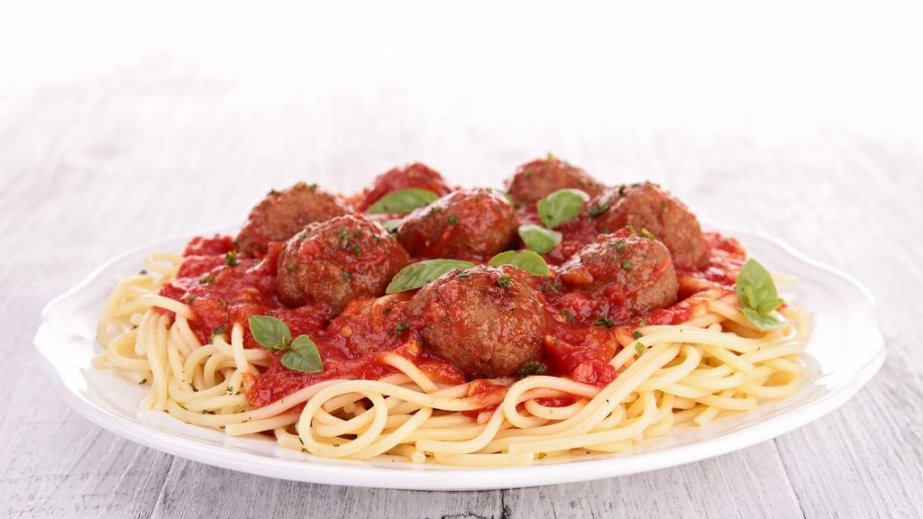 Spaghetti With Meatballs · Classic spaghetti pasta topped with house made marinara sauce and hearty beef meatballs and served with a side salad and garlic bread.
