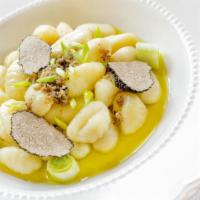 Potato Gnocchi · Tender house made potato gnocchi served in a savory house sauce and served with a side salad...