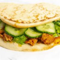 Chicken Tikka Masala Naan · tamarind sauce, cucumbers, paneer cheese, green chutney, naan (w/o nuts)