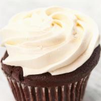 Chocolate Cupcake · rich chocolate cake made with whole wheat flour and mounded high with vanilla buttercream