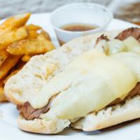 Beef Brisket Sandwich · Roasted beef brisket, horseradish cheddar cheese on a baguette  with au jus.