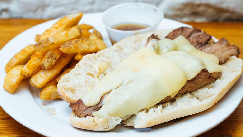 Beef Brisket Sandwich · Roasted beef brisket, horseradish cheddar cheese on a baguette  with au jus.