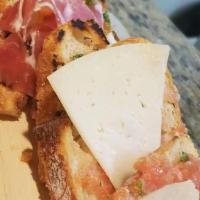 Montaditosde Jamon Y Queso · Allergens dairy, wheat
Roasted baguette with tomato spread, manchego cheese, and jamon cerra...