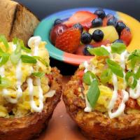Hash Quiche · Two crispy fried hash brown bowls stuffed with scrambled eggs, bacon, roasted red peppers, o...