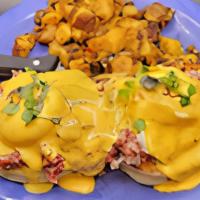 Irish Benny · Thick cut English muffin with our house corned beef hash, two poached eggs & Hollandaise. Se...