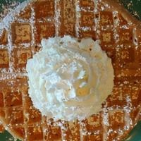 Waffle · An 8” Belgian waffle from our homemade mix, topped with powdered sugar & whipped cream.