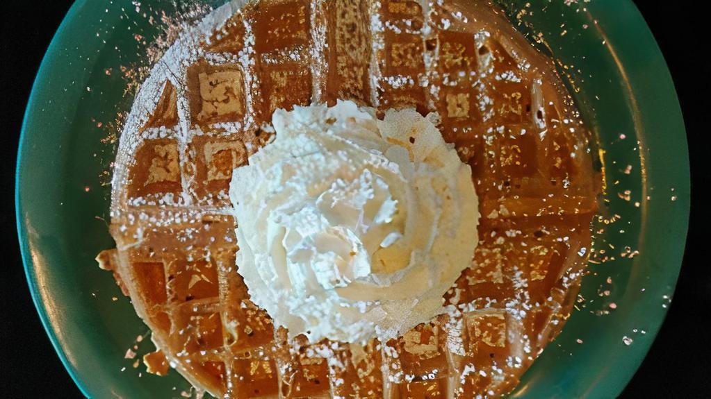 Waffle · An 8” Belgian waffle from our homemade mix, topped with powdered sugar & whipped cream.
