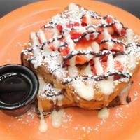 Highway Strawberry · Two slices of thick cut French toast topped with Cheesecake glaze, chocolate drizzle, strawb...
