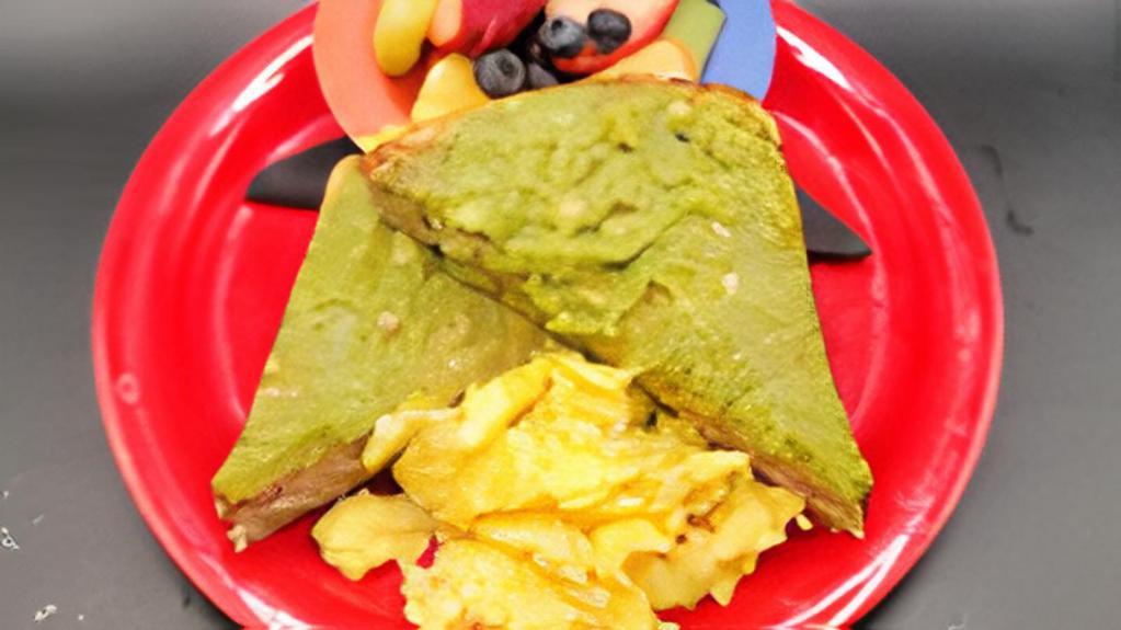 Tiny Avocado Toast · Our toasted wheat bread loaded with avocado. Served with scrambled egg and fruit salad.