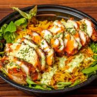 New York Style Grilled Chicken Over Rice · Grilled chicken served over rice and lettuce. Comes with red and white sauce.