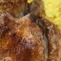 Pork Chops &  Eggs (3) · Two grilled chops.