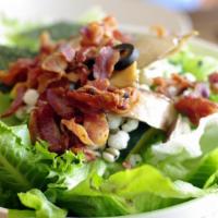 Bacon Salad · Crisp lettuce salad with mouthwatering bacon, black olives, croutons, cucumbers, green peppe...