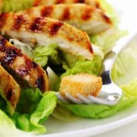 Grilled Chicken Salad · Crisp lettuce salad with protein packed grilled chicken, black olives, croutons, cucumbers, ...