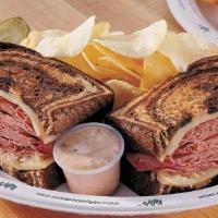Reuben · Thinly sliced first cut cured brisket, imported swiss & sauerkraut served on grilled marble ...