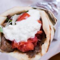 Gyro Pita · Spiced lamb and beef strips with feta sauce, tomato, onion, and parsley.