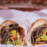 Steak & Cheese Sub · Steak, cheese, lettuce, tomato, mayo, grilled onion, and hot peppers.