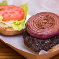 Greek Burger · 1/2 lb. burger with feta, tzatziki, grilled red onions, lettuce and tomato.