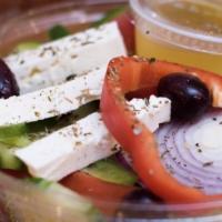 Greek Village Salad · Cucumbers, tomatoes, onions, feta cheese, kalamata olives and green peppers. Topped with ore...