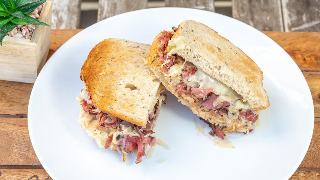 Reuben (Delicious Yet Healthier Version) · First cut pastrami, corned beef or turkey with Sauerkraut, Swiss cheese & Russian dressing on Rye.