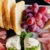 Charcuterie Board · charcuterie and cheeses are served with fresh fruit and appropriate accompaniments. BURRATA ...