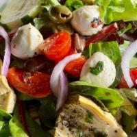 Limoncello Tossed Salad · spring mix, olives, red onions, cucumber, cherry tomato, marinated artichoke, roasted red pe...
