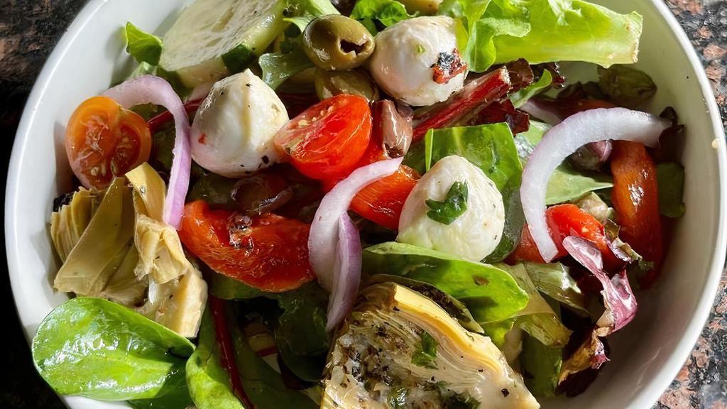 Limoncello Tossed Salad · spring mix, olives, red onions, cucumber, cherry tomato, marinated artichoke, roasted red peppers, fresh mozzarella balls, basil white balsamic vinaigrette