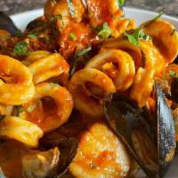 Pescatore · lobster tail, shrimp, calamari, mussels, clams over linguine. choice of sauce