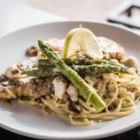 Chicken Limoncello · egg-dipped chicken, asparagus, lump crab, lemon, white wine sauce served with pasta or veget...