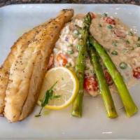 Bronzino · European seabags, parmesan risotto with cherry tomato, sweet peas, grilled asparagus, topped...