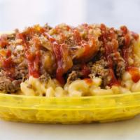 'Wit' Mac · Original mac topped with chopped philly steak, caramelized onions, ketchup drizzle & potato ...