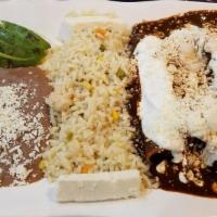 Enchiladas De Bistec / Steak Enchiladas · Servidas en salsa verde, rojas o mole, con queso y cebolla. / Served with cheese, onion and ...