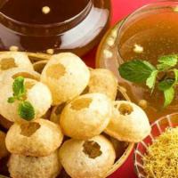 Pani Puri · Seven six puri filled with potato, chickpeas tamarind chutney and served with chilled spicy ...