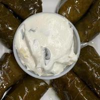 Dolma · Vegetarian Item. Eight peice set. Grape leaves stuffed with rice, onion and parsley. Served ...