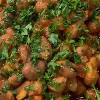 Foul · Vegetarian Item. Fava beans, tomatoes, lemon juice, garlic, parsley and olive oil. Served wi...