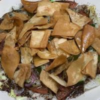 Fattoush Salad · Vegetarian Item. Iceberg lettuce, sliced tomatos, cucumbers, green bell peppers, garlic, oni...