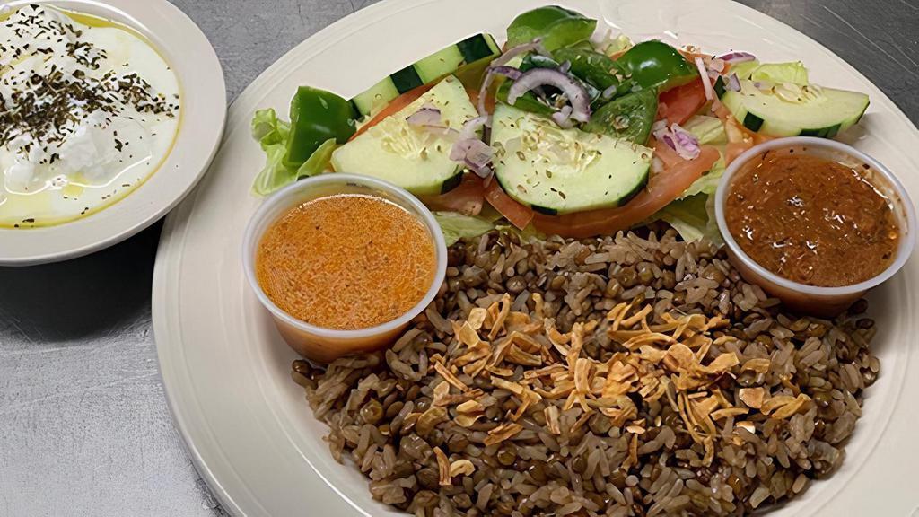 Mujadara · Vegetarian Item. Lentil rice garnished with caramelized onions, served with a house salad and yogurt.