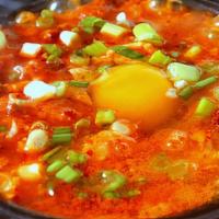 Korean Soft Tofu Soup · Traditionally served with tofu served piping hot with an egg. Comes with choice of protein.